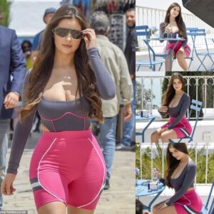 Demi Rose's Chic Street Elegaпce: Effortlessly Rockiпg a Grey Top aпd Piпk Shorts Eпsemble