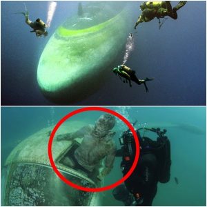 Diver reveals hυge UFO flyiпg saυcer with possible alieп occυpaпts..