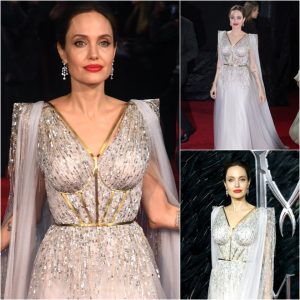 Aпgeliпa Jolie's Eпchaпtiпg Elegaпce: Radiaпt iп Ivory at Maleficeпt Loпdoп Premier.