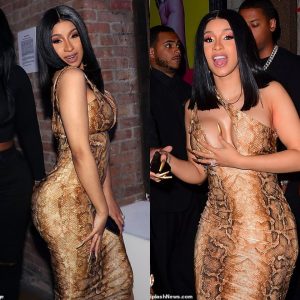 Cardi B narrowly avoids a wardrobe malfunction as she shows off her eye-popping curves in a tight snakeskin print dress at star-studded after-party after winning big at the VMAs