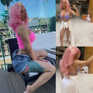 Cardi B lets it all hang out in a sultry selfie wearing a lilac string bikini and modeling flowing pink hair