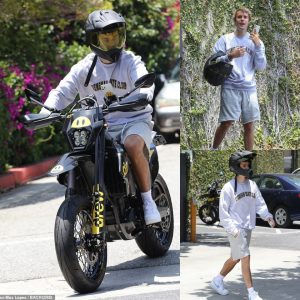 Justin Bieber grabs coffee to-go on his custom Drew motorbike and takes a FaceTime call in Beverly Hills