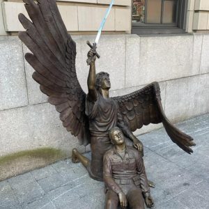 900-pound sculpture of St. Michael holding a downed policeman beneath his wings at New York Police Department 32nd precinct