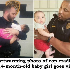 Heartwarming photo of cop cradling a 14-month-old baby girl goes viral