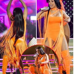 Cardi B wows in an orange adorned leotard as she performs at Remote Celebration while her super fan Janet Jackson watches her from the groups