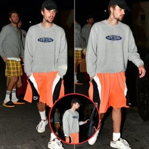 Justin Bieber sports a scruffy beard as he wears a New York sweatshirt and shorts while out for dinner in Beverly Hills without wife Hailey Bieber